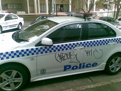To remove graffiti from a vinyl fence purchase some pain remover that says it can be used on vinyl. Cop car graffiti | Cop car parked outside the NSW Police ...