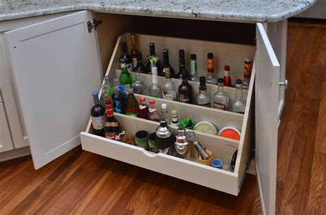 This post was edited by may_flowers on fri. Pull-out bar drawer houses liquor bottles for easy ...