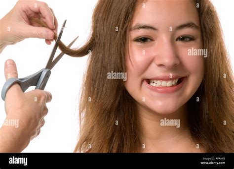 Caucasian Teen Girl With Long Brown Hair Getting Haircut Hi Res Stock