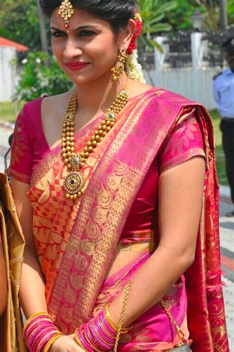 The saree is all plain but the border of the saree is a temple border which. Amazing Pink Wedding Wear Soft Silk Saree With Blouse