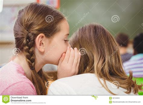 Pupils Whispering Secrets During Class Stock Image - Image of happy ...