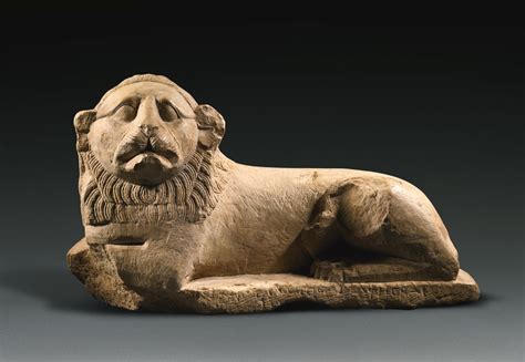 An Egyptian Indurated Limestone Figure Of A Lion Ptolemaic Period