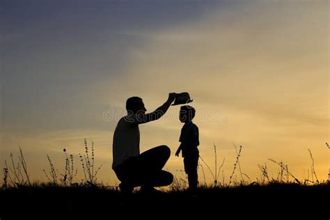 Silhouette Of Father And Son Play On Sunset Stock Photo Image Of