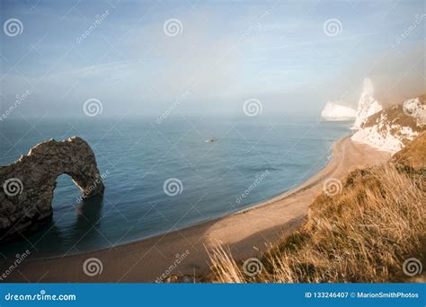 Durdle Door Is A Natural Limestone Arch On The Jurassic Coast Ne Stock