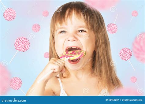 Happy Little Girl Eating A Lollipop Candy Stock Image Image Of