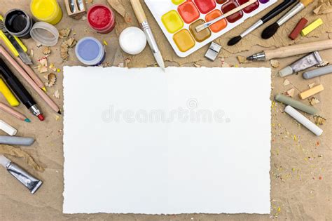 Desktop With Blank Paper Sheet And Various Drawing Tools Stock Photo