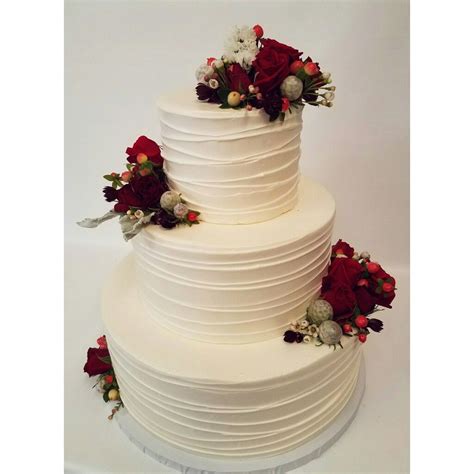 Wintery Blooms Make This Rustic Wedding Cake Feel Extra Christmas Y And