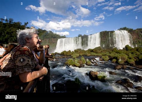 Iguazu Falls Tourists Contemplate The Waterfalls From The Brazilian