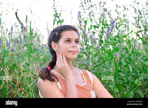 Russian Girl Dreams Against The Background Of A Wild Flowers Stock