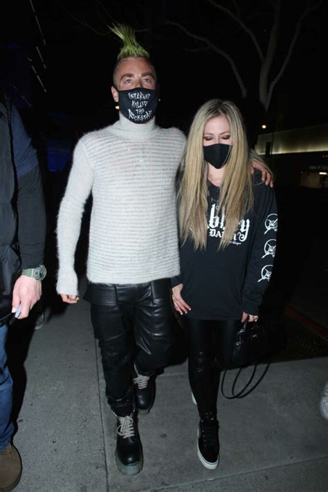 Avril Lavigne In A Black Outfit Arrives At Boa Steakhouse With Mod Sun For A Dinner In West