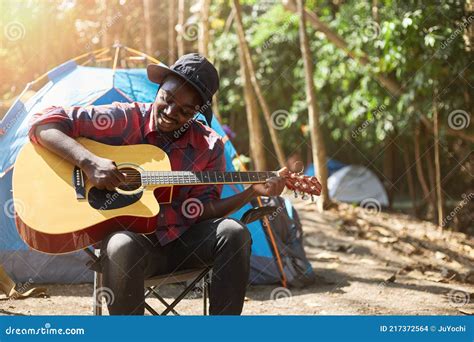 A Black Man Playing Guitar While Camping Stock Photo Image Of Camp