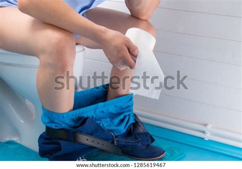 Man His Pants Down Sitting Bathroom Stock Photo 1285619467 Shutterstock