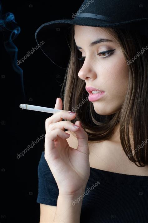 Portrait Of The Beautiful Elegant Girl Smoking Cigarette Isolated On
