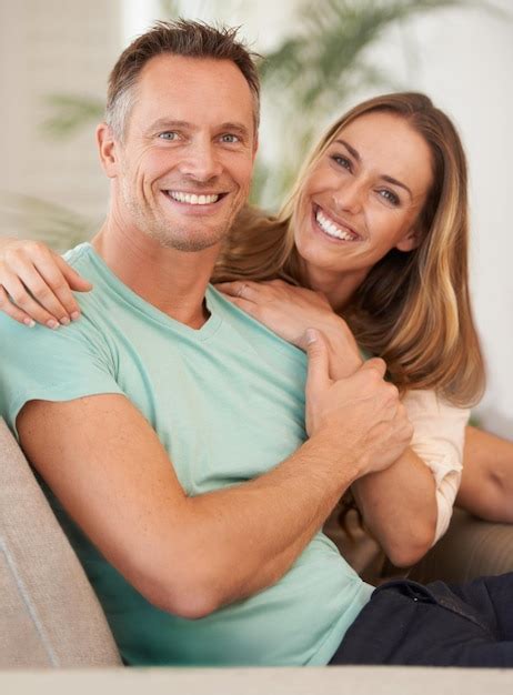 Premium Photo The Picture Perfect Couple Portrait Of A Happily Married Couple Sitting On The