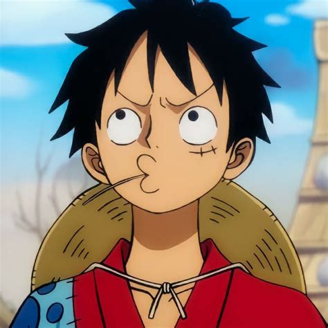 An Anime Character With Black Hair And Big Eyes Wearing A Red Shirt