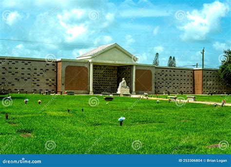 Landscape View of a Mausoleum, Marble Benches and Trees at the