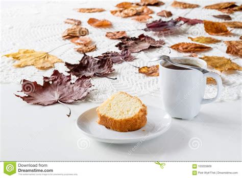 An Autumnal Day A Cup Of Tasty Tea And Cake Next To Dry Maple Stock Image Image Of Orange