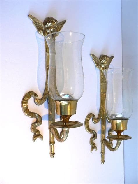 The whole is perfectly integrated into the hallway or bedroom. Pair of Brass Cherub Hurricane Lamp Wall Sconces by ...