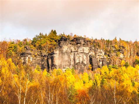 Sandstone Rock Formation In The Middle Of Autumn Forest Stock Photo