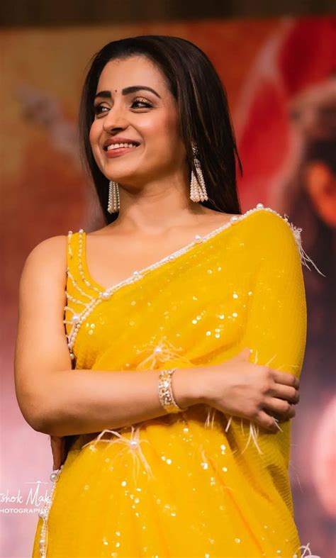 Trisha Krishnan Shines Bright In A Yellow Sequinned Saree For Ponniyin Selvan I Promotions