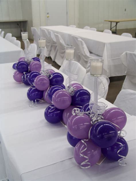 View our custom balloon designs / balloon decorations which include arches, columns (or towers), dance floor designs, bouquets, centerpieces, sculptures and more! purple wedding centerpieces | Balloons Denver