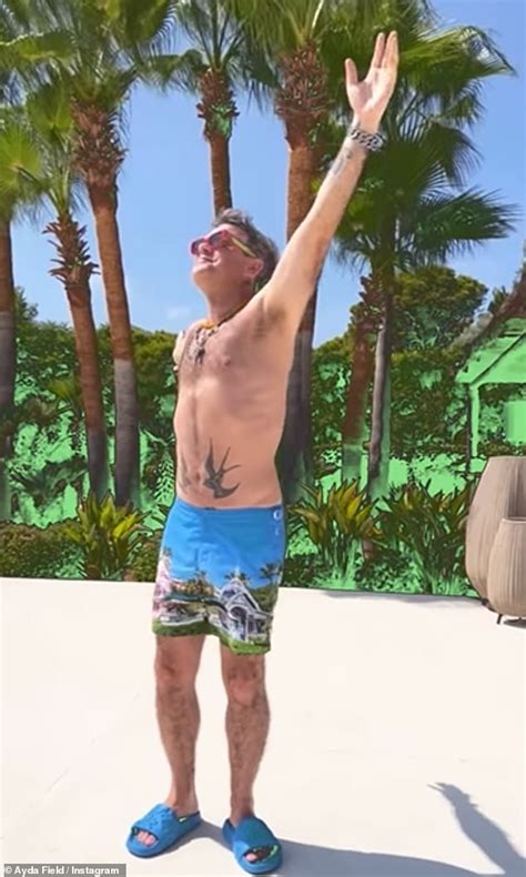 Robbie Williams Dances In His Swim Shorts As He Enjoys Lavish Getaway With Wife Ayda Field In