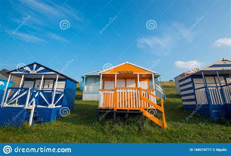 Colourful Wooden Beach Huts Facing The Ocean At Whitstable Coast Kent