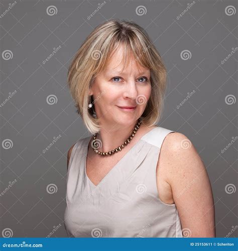 Attractive Smiling Mature Woman On Grey Stock Image Image Of Eyed