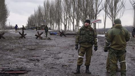 Pro Russian Rebels Stand Near A Seized Checkpoint Near Debaltseve In