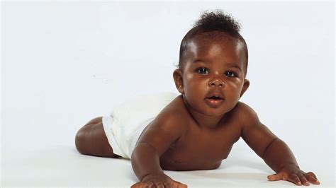 Cute African Baby Is Crawling On Floor In White Background Hd Cute