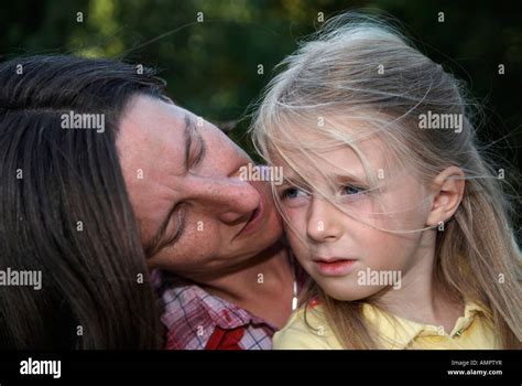 A Young Mother Talking To Her Six Year Old Daughter Stock Photo Alamy
