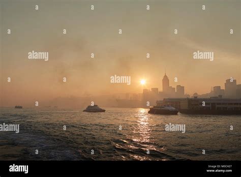 Sunrise Over Victoria Harbour With Morning Ferrys Crossing And The