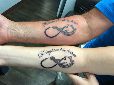 father daughter tattoo infinity symbol done by mike long anchored ink eugene oregon