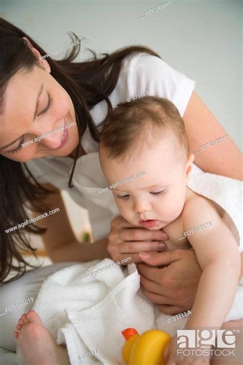 Mother Drying Baby With A Towel Stock Photo Picture And Royalty Free