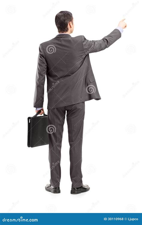 Full Length Portrait Of A Businessman Pointing In A Direction S Stock