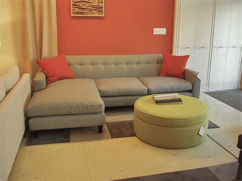 Apartment Sectional Sofas With Chaise On One Side Together With Round Ottoman Coffee Table And Rug Plus Red Cushion 