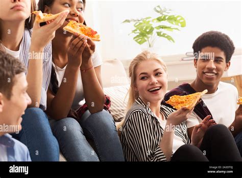 Pizza Time Diverse Friends Eating And Talking Stock Photo Alamy
