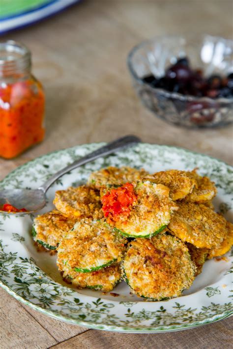 Toss zucchini spirals or slices in corn starch. Recipe: Oven-Baked Zucchini Parmesan Crisps | Kitchn