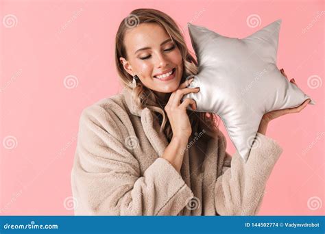 Pretty Woman Posing Isolated Over Pink Wall Background Holding Pillow