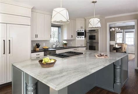 Reliance quartz countertops are fun, affordable, and look terrific in any kitchen or bathroom setting. White and gray kitchen features white perimeter cabinets ...