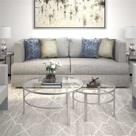 Add style and a touch of simple elegance to a room with the stark modern lines and clear surface of this piece. Evelyn&Zoe Contemporary Nesting Coffee Table Set with ...
