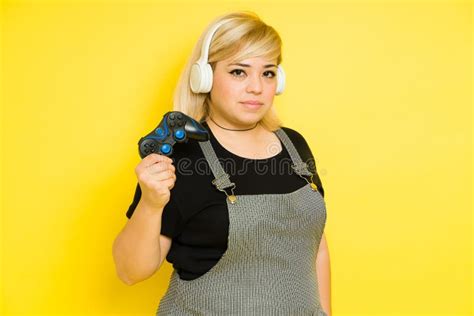 Chubby Gamer Woman Ready To Play Holding A Controller And Wearing
