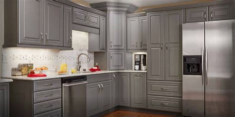 Silver is the most common color of hardware used with gray kitchen cabinets, but many other metallic finishes also mesh well. grey stained kitchen cabinets - Google Search | Logan Blvd | Pinterest | Kitchens, Grey kitchen ...