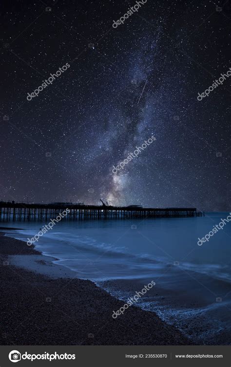 Stunning Vibrant Milky Way Composite Image Landscape Pier Construction