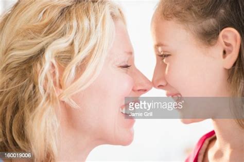 Mother And Daughter Rubbing With Noses Photo Getty Images