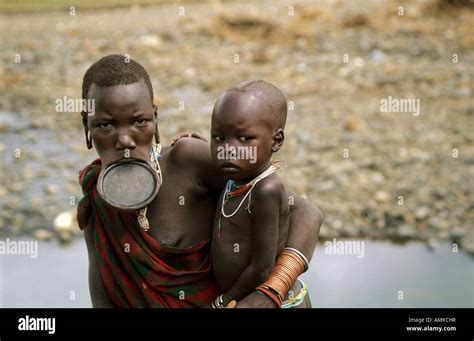 Surma Woman With Her Baby Along The Kibish River Lower Omo Valley