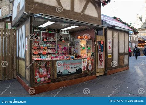 Market Vendor Stall Selling Christmas Fragrances And Ts In An