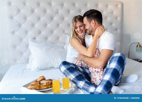 Young Attractive Couple Having Breakfast In Bed Stock Photo Image Of