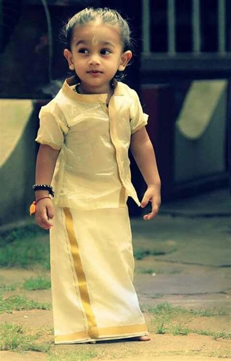 Cute Kerala Kid Wearing Traditional Kerala Wear Kasavu Mund And Shirt