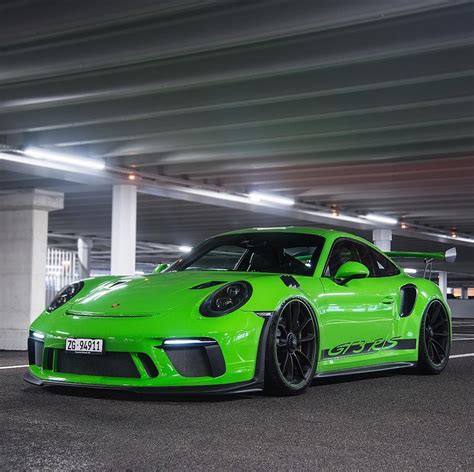 A Lime Green Porsche Gtr Parked In A Parking Garage